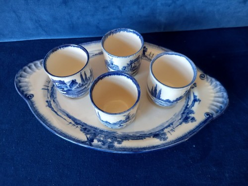 Set four egg - cups, and