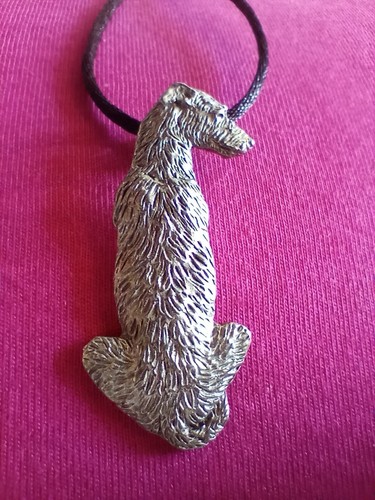 Scottish deerhound sitting - scottish,