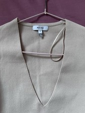 Women's knitted blouse. Pale