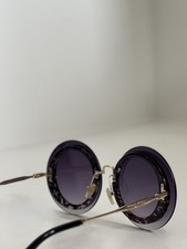 Miu Miu ROUND Sunglasses | |