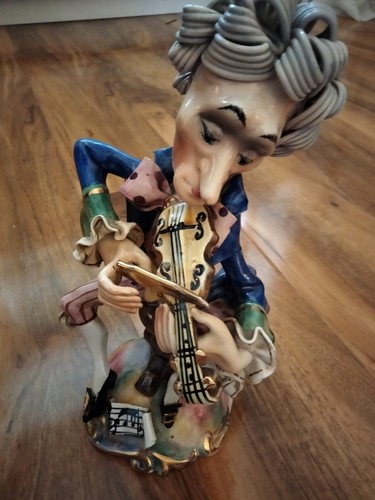Vintage figurine man playing - vintage, a