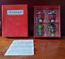 Four miniature masks - four,