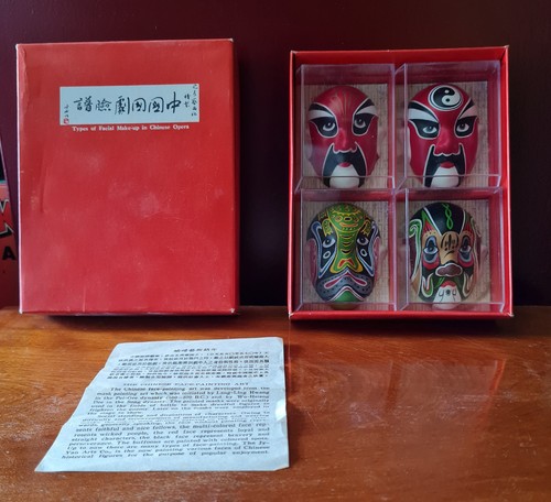 Four miniature masks - four,
