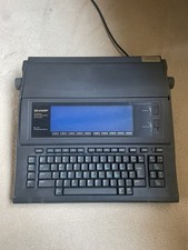 Sharp Electronics PA-W1410 UM Personal Word Processor Portable Typewriter
