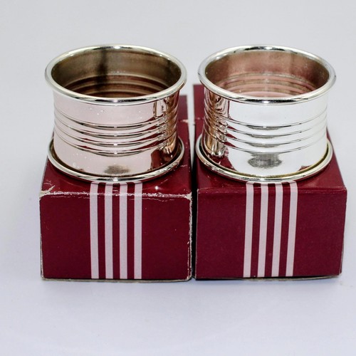 Two individually boxed silver - two,