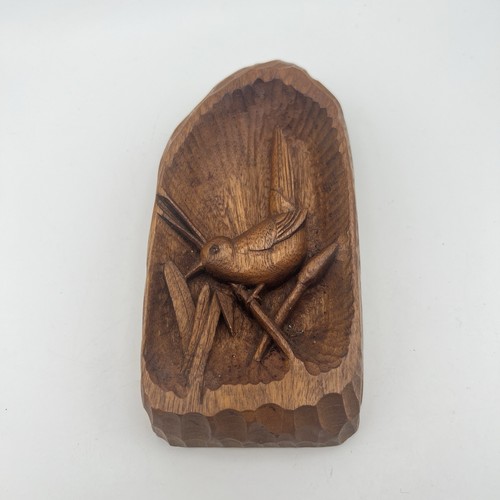 Hand carved wooden bird - hand,