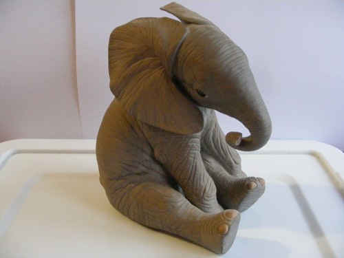 Elephant calf on - elephant, wooden