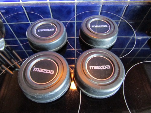 Set old mazda wheel centre - 4x,