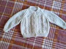 Hand knitted baby cardigan to