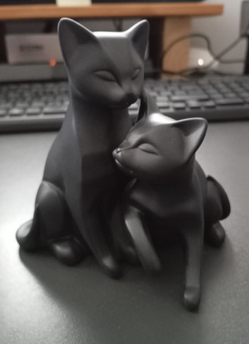 Black cats cuddled up - black,