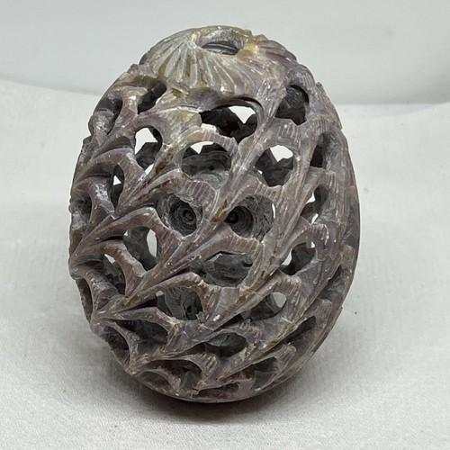 Carved soapstone egg with - carved,