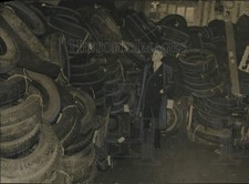 1942 Press Photo F. G. Kaiser with pile of scrap automotive tires in New York