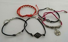FIVE MULTI COLOUR 6.1/2" FABRIC, ADJUSTABLE BRACELETS WITH METAL DECORATION