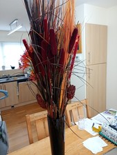 Faux Flowers in Large Almost Black Mottled Glass Vase