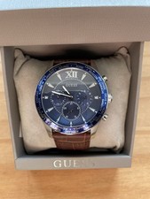 Guess Men's Tycoon W1262G1 watch with a brown leather strap and blue dial