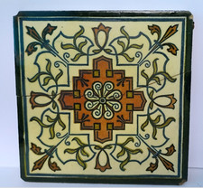 6" ANTIQUE CERAMIC WALL TILE GLAZED. CRACKED IN HALF. STUCK ON BOARD.