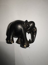 A PAIR OF ANTIQUE  EBONY  HAND CARVED WOODEN ELEPHANTS