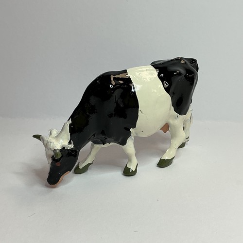 Britains farm cow feeding - cow,