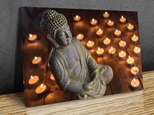 Statue of Buddha with candles
