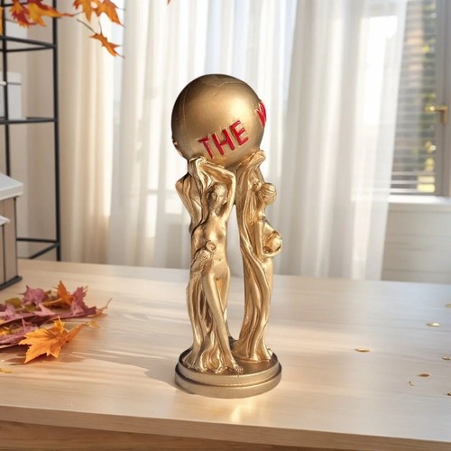 Gold three people statue - three, world