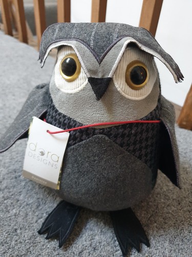 Dora designs weighted doorstop - dora,