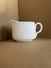 Small Porcelain Milk Jug with Ribbed Pattern. Approx 6cm high.