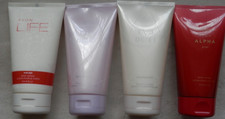 4 ASSORTED AVON BODY LOTIONS. (Discontinued)