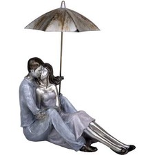 COUPLE SITTING FIGURINE WITH