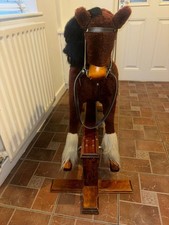 A Brown Medium Sized MJ Mark Rocking Horse