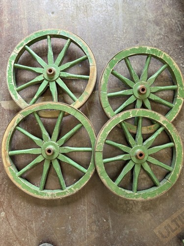 Four wooden cartwheels with - cartwheels,