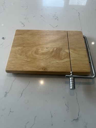 Wooden cheese board with - cheese,