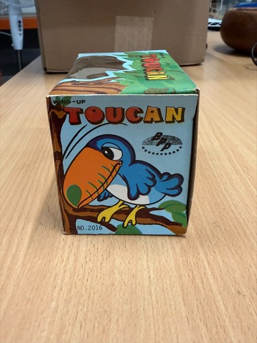 Vintage tomy wind - wind, toucan