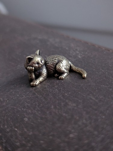 Solid brass lying cat - lying,