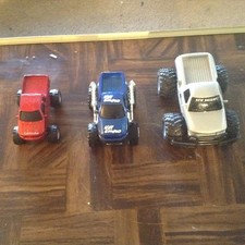 Three monster trucks