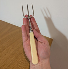Silver toasting fork with bone