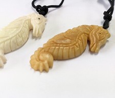 Hand carved seahorse charm - carved,