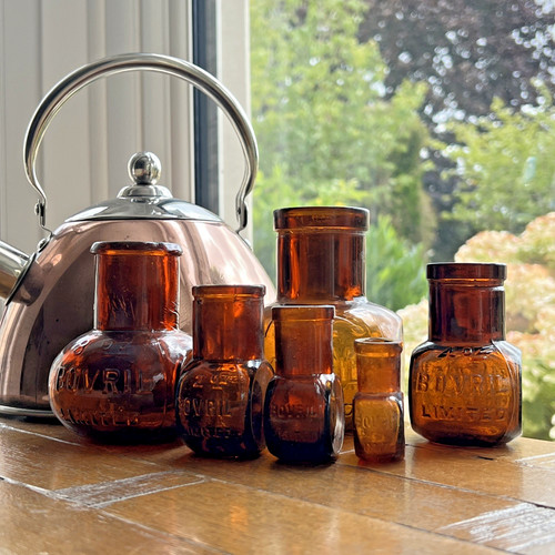 Amber bovril glass jars old - jars,