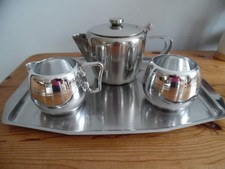 STAINLESS STEEL TEA SET ON TRAY. TEAPOT, VINTAGE MILK JUG & MATCHING SUGAR BASIN