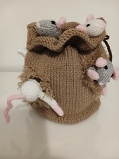 Hand knitted tea cosy. Sack of