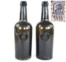 N719 TWO ANTIQUE RICKETTS PATENT BOTTLES WITH CIRCULAR CRESTED SEAL MONOGRAM