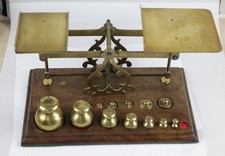 Antique wooden & brass postal scales & graduated weights