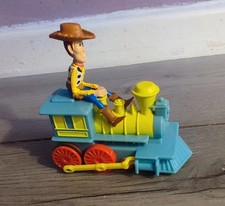 Disney toy story woody on a train, pull back train