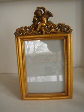 Cherub putti.  gold gilt