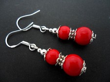 A PAIR OF RED CORAL BEAD