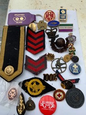 collection of assorted badges new and old 