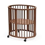 Stokke Sleepi Mini, Warm Brown - Oval Crib Suitable for 0-6 Months - Height-Adjustable Base, Lockable Swivel Wheels, Perforated Mattress Base for Air Circulation