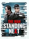 The Man Standing Next