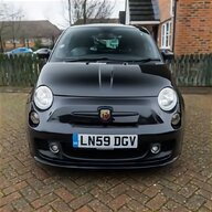 abarth centre caps in yellow for sale